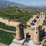 Hisor Fortress in Tajikistan with its iconic arched gate on the 5 Stans Tour.