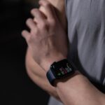 close up view of a person wearing black smartwatch