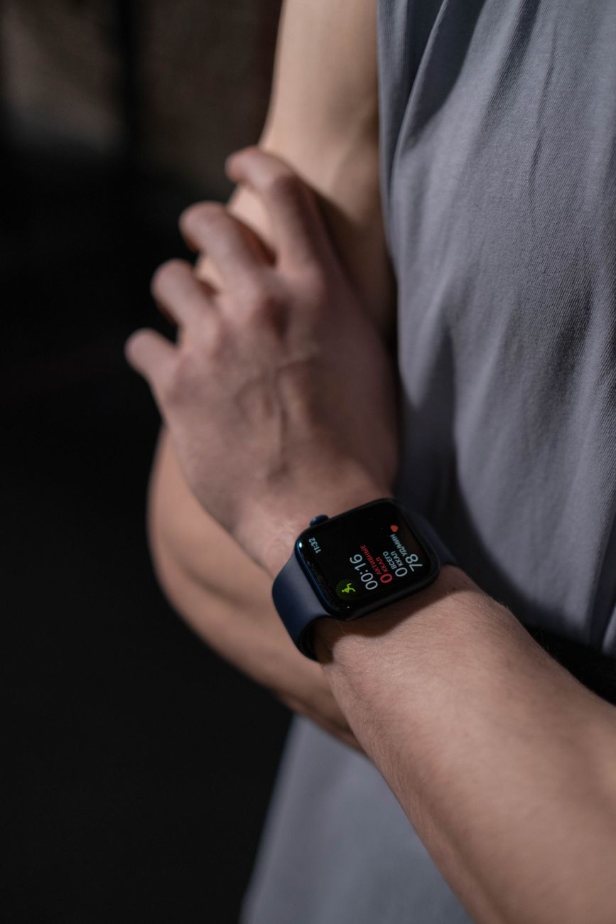 close up view of a person wearing black smartwatch