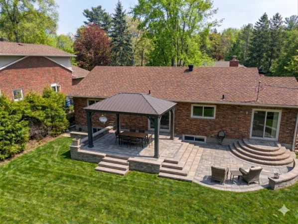 AI-generated backyard landscaping design featuring a massive, cascading multi-tiered stone patio with oversized circular staircases wrapping around a raised dining area under a wooden pergola.