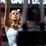 woman exercising upper muscle groups at the gym